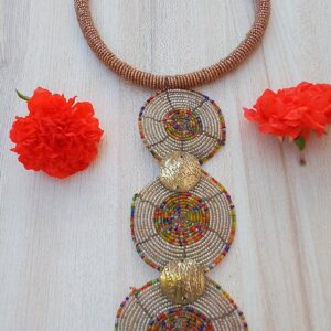 Colourful Maasai hoop handmade necklace in various designs to match your look! These beautiful beaded necklace will make you look lovely like the traditional Maasai women who wear them every day in the Plains of East Africa.